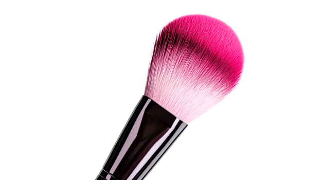Pink makeup brush with thick bristles against a black backdrop, cut out transparent png