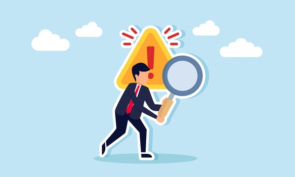A businessman holding a magnifying glass standing in front of a warning sign, illustration of restrictions and limitations in business research vector