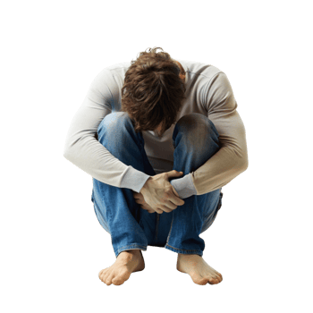 Depressed man seated on the ground, clasping his hands over his head, expressing emotional distress and hopelessness png