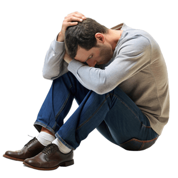 Young man curled up on the floor in a defeated posture, displaying emotional pain, mental health struggles, and despair png