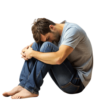Despondent male sitting with his head down, showing signs of stress, sadness, and emotional exhaustion in a vulnerable moment png
