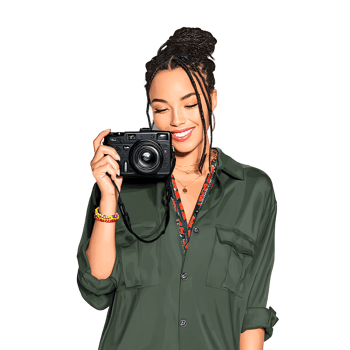 A woman holding a camera and smiling png