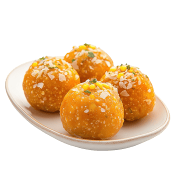 Four laddu on a plate on transparent background. png