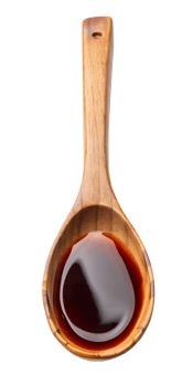 wooden spoon with dark sauce png