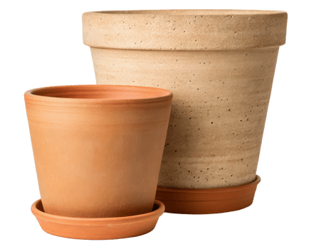 Two terracotta pots with matching saucers for plants on a transparent background png