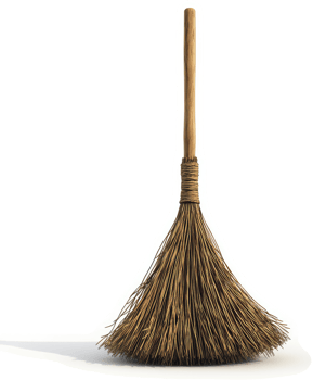 A rustic straw broom stands tall and ready for use. png