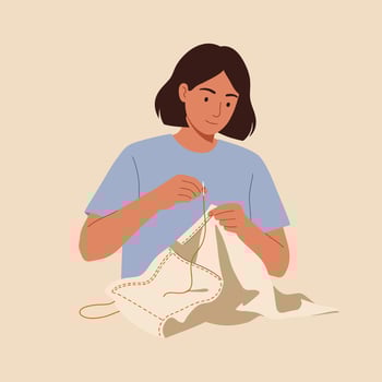 Woman sewing fabric with needle and thread in casual blue shirt crafting textile hobby indoors vector