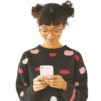 Asian female young adult using smartphone with glasses and polka dot sweater png