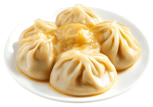 Steamed dumplings, glistening with savory sauce, served on a white plate. png