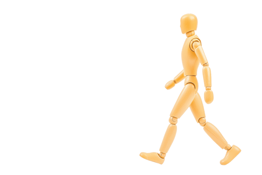 A wooden mannequin is depicted walking with confident stride, showcasing human like movement. figure is articulated, allowing for various poses, and is set against plain background, emphasizing its png
