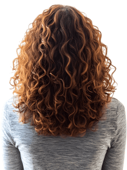 woman with fiery red curly hair, viewed from behind. The texture and vibrancy of the curls, captured in a photorealistic style. isolated on transparent background png