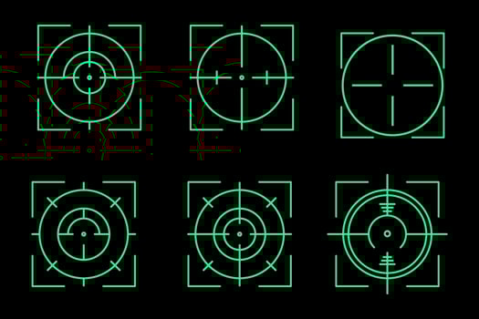 a set of green crosshairs target on a black background vector