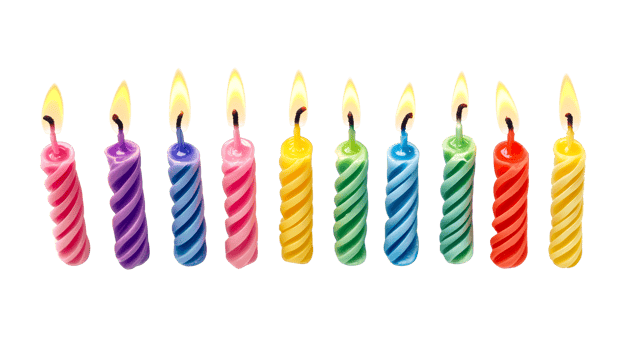 Lit colorful birthday candles row, cut out transparent png