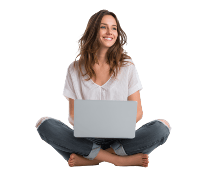Young woman working on laptop while sitting cross-legged at home png