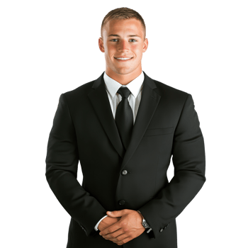 Professional business man in formal suit standing confidently with a smile in bright white background png