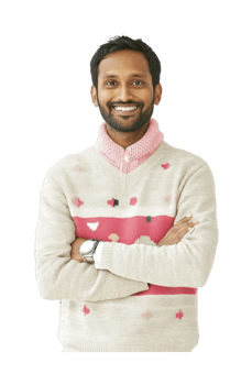 Smiling young south asian male in sweater with crossed arms png