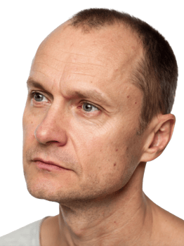 Thoughtful middle-aged Caucasian man with short hair, gazing into the distance, conveying a sense of contemplation. png
