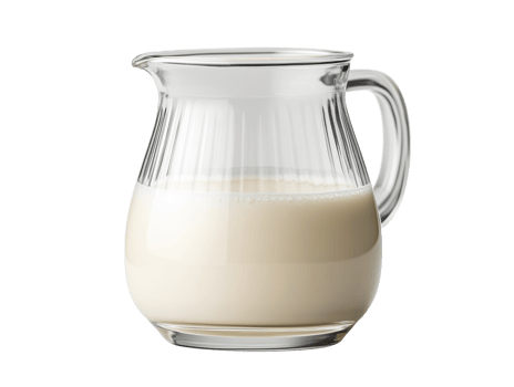 Fresh milk in a clear glass jug on a kitchen countertop for cooking png