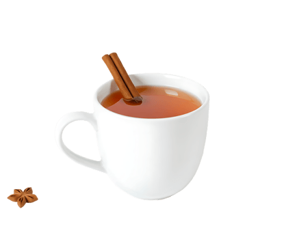 A cup of warm apple cider with a cinnamon stick and star anise png