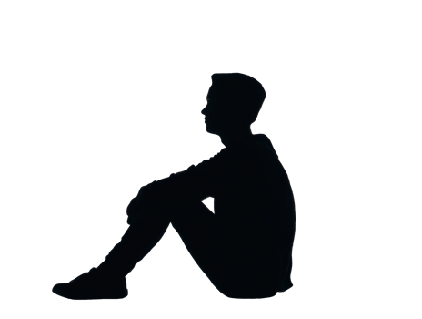 Silhouette of a lone person sitting pensively on the ground png