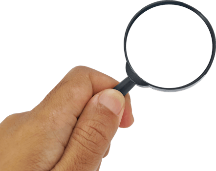 Man's hand holding a magnifying glass png
