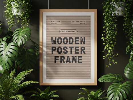Wooden Poster Frame Mockup Hanging on Green Wall with Indoor Plants psd