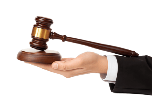 A Wooden Gavel in a Hand Wearing a Business Suit Suggests Legal Proceedings or Judicial Decisions png