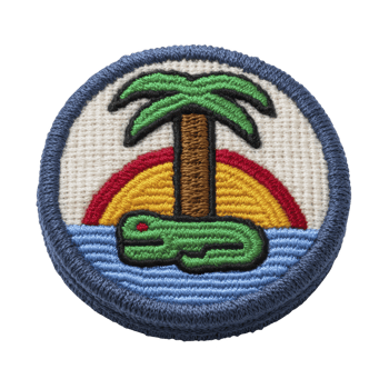 Colorful embroidered patch features palm tree, sun setting in background, and green alligator on blue water, evoking tropical island vibe png