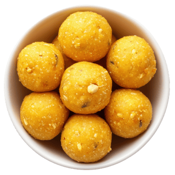 Bowl of yellow laddu balls on transparent background png