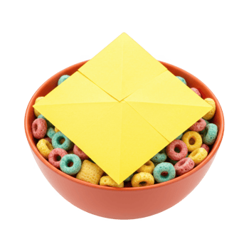 Yellow Origami Pyramid on Bowl of Colorful Cereal isolated on transparent background png