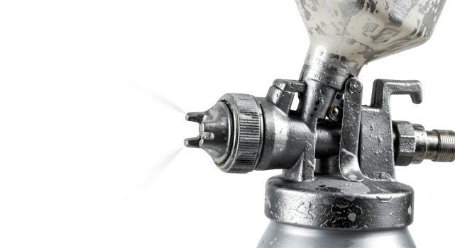 Close-up View of a Silver Metal Spray Gun with Paint Spraying png
