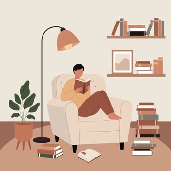 Man enjoying quiet reading time in warm home corner vector