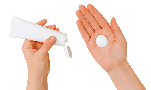 Hands holding cream and a tube of cream png