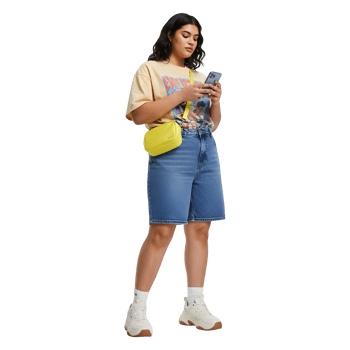 Stylish Woman in Denim Shorts, Graphic Tee, and Trendy Accessories png