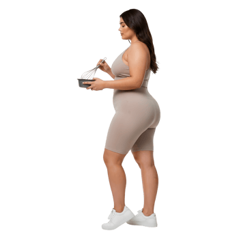 A Woman in Beige Activewear Preparing a Healthy Snack png