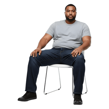 Confident Plus Size Man Sitting Comfortably in Modern Chair png