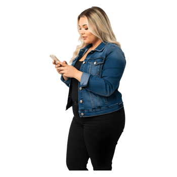 Young Woman in Denim Jacket Uses Smartphone with Focused Attention png