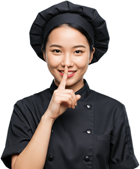 Smiling Asian chef in black uniform gesturing silence with finger to lips png
