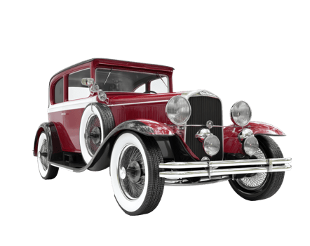 Vintage red car with white accents parked in urban setting png