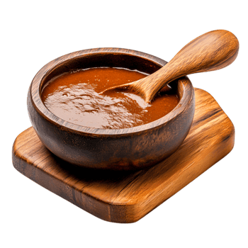 Rich and Smooth Chocolate Sauce in Wooden Bowl with Wooden Spoon on Rustic Board png