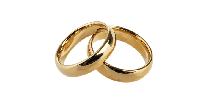 Two gold wedding rings interlocked isolated on transparent background png