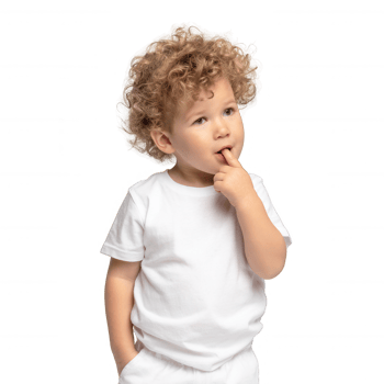A thoughtful young boy with curly hair, dressed in a plain white t-shirt, standing against a white background, with a finger in his mouth, conveying curiosity and innocence. png