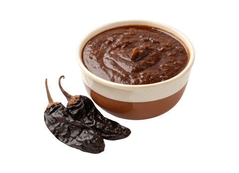 A bowl of Mole poblano sauce with Ancho chilies isolated on a transparent background food design png