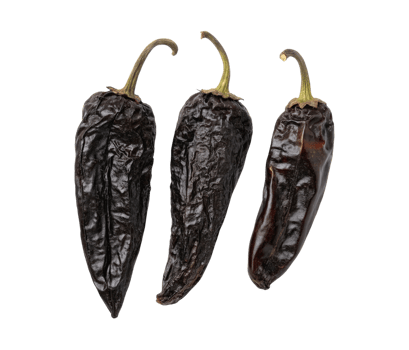 Three black dried Poblano Ancho chilies isolated on a transparent background food design png