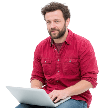 A man in a red shirt working on a laptop, focused and engaged, showcasing the modern workspace lifestyle. png