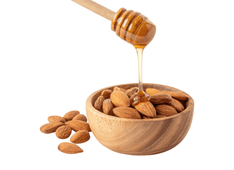 Golden honey dripping from a wooden dipper into a wooden bowl of almonds isolated on a transparent background png