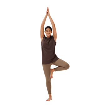 Young woman practices tree pose in yoga, cultivating balance and serenity png