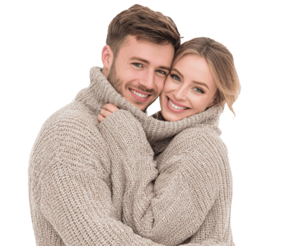 Warm embrace of couple in cozy knit sweaters during winter season png
