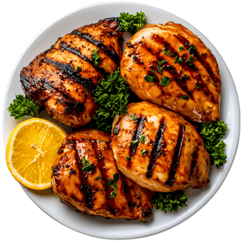 Grilled Chicken Breast on White Plate with Fresh Herbs and Lemon Slice png