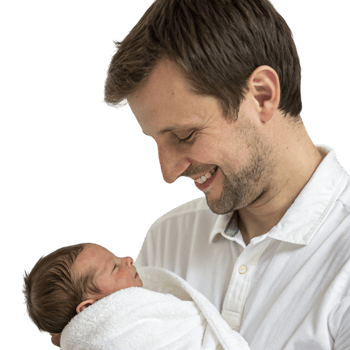A man holding a baby wrapped in a towel png